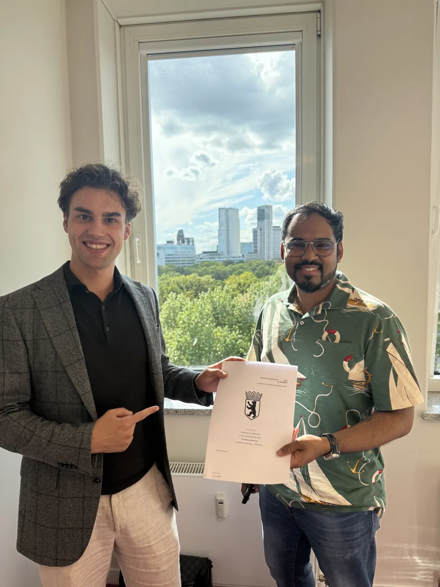 Client and LDP consultant holding the signed purchase contract